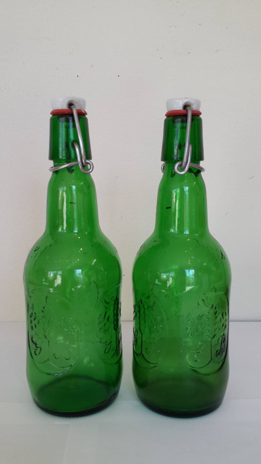 Green glass bottles with stopper, vintage stock