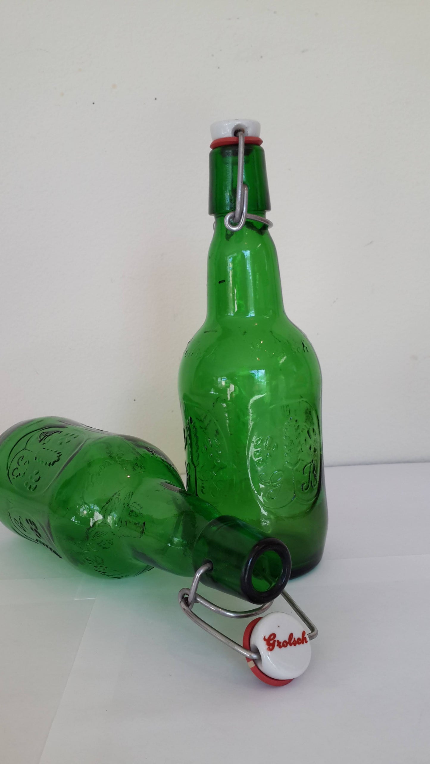 Green glass bottles with stopper, vintage stock