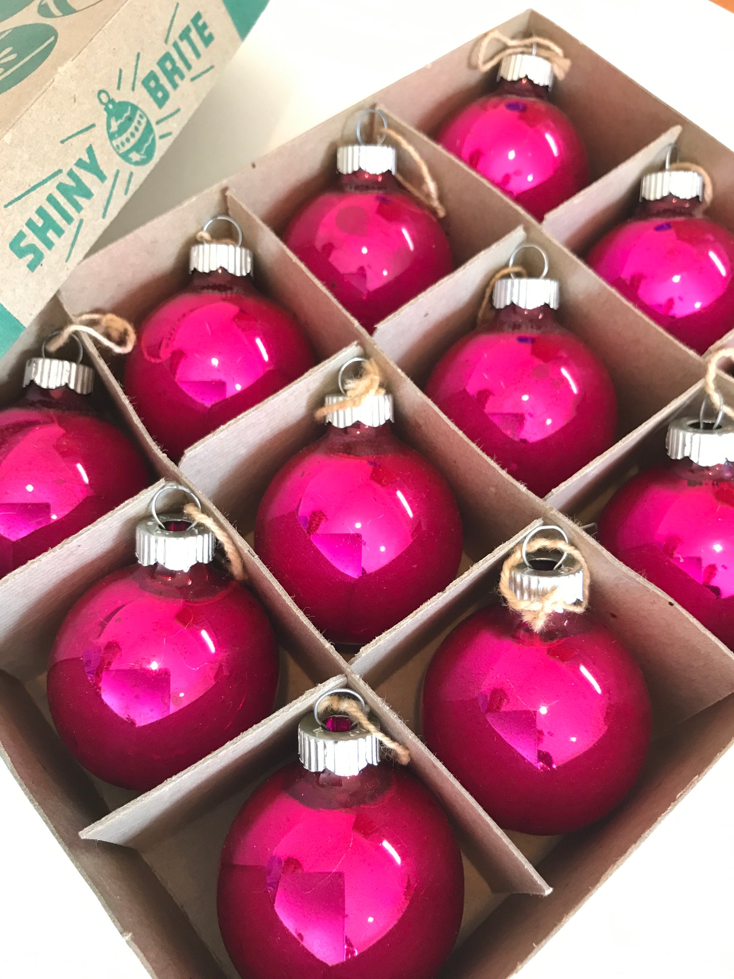 Shiny Brite Christmas ornaments in hot pink