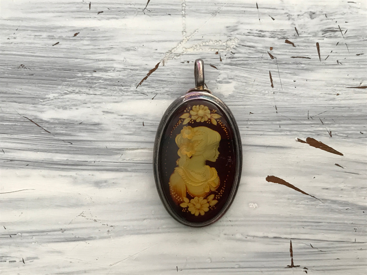 Large cameo carved amber pendant