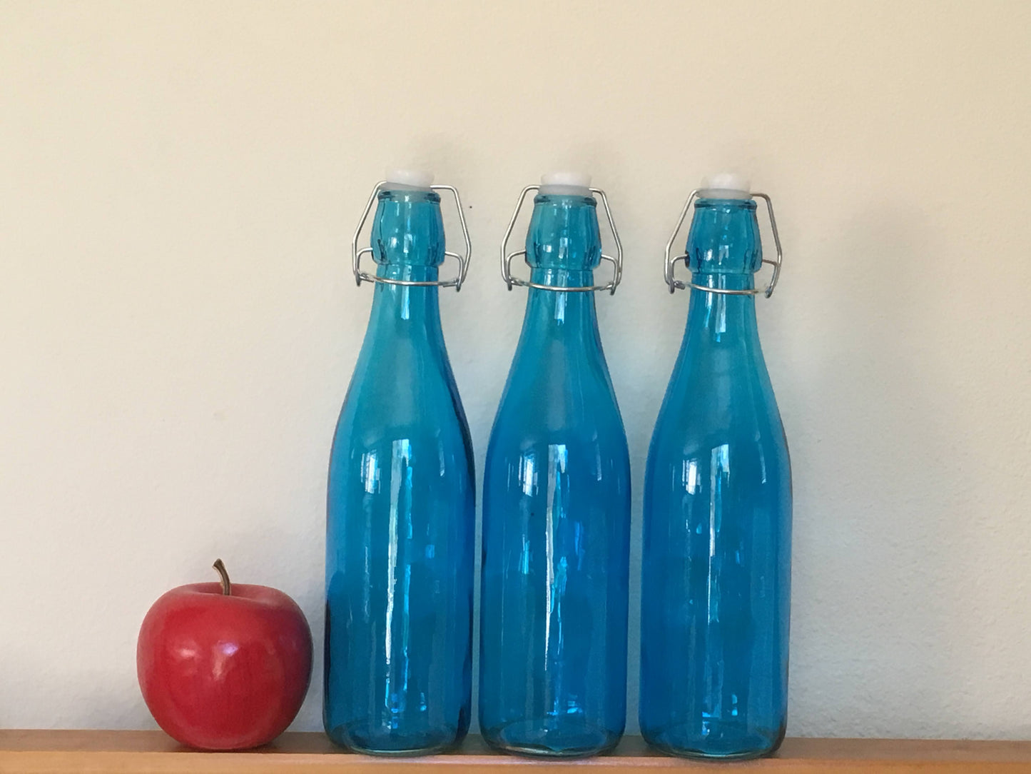 Tall blue glass bottle