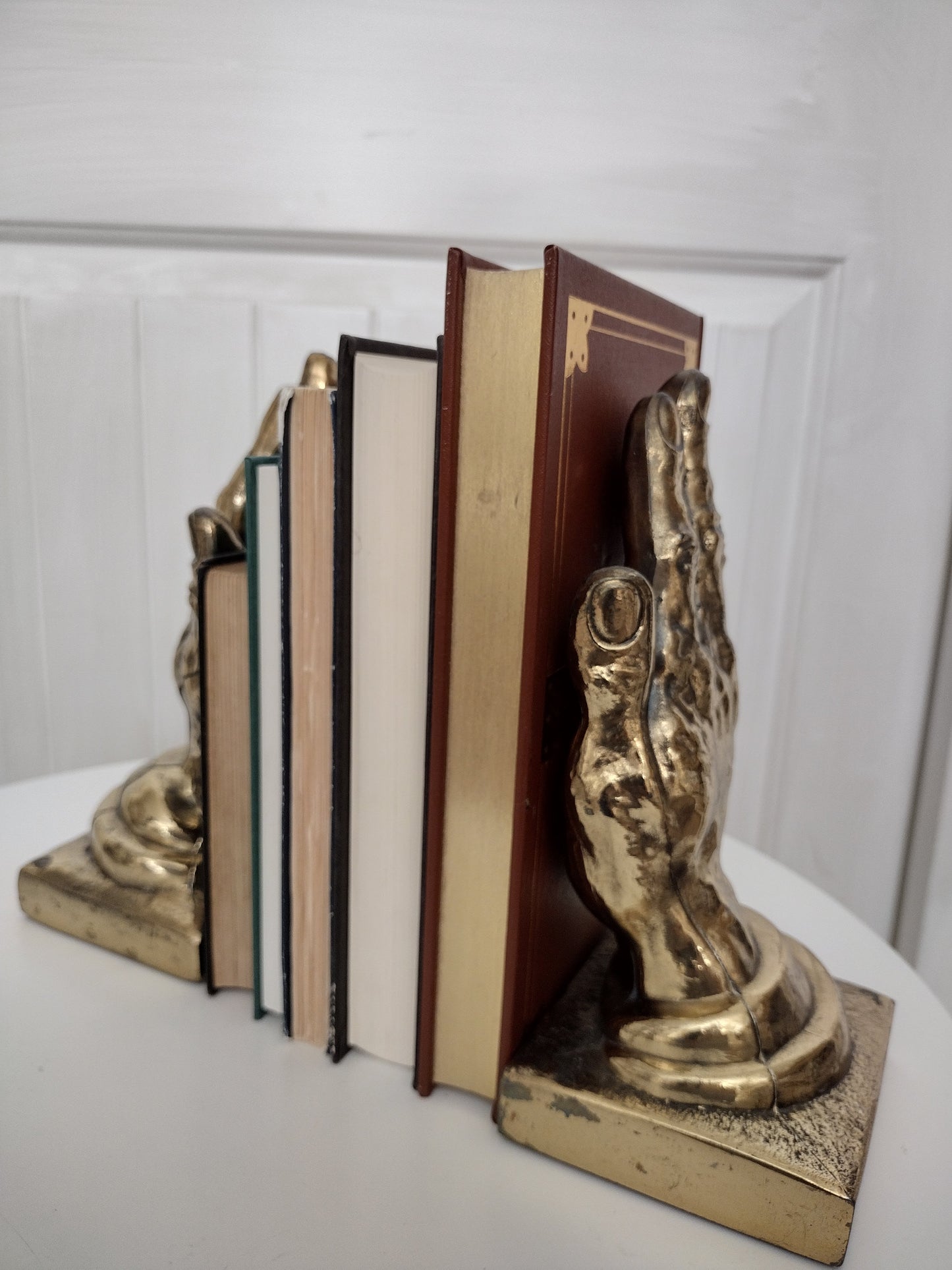 Vintage brass hand bookends